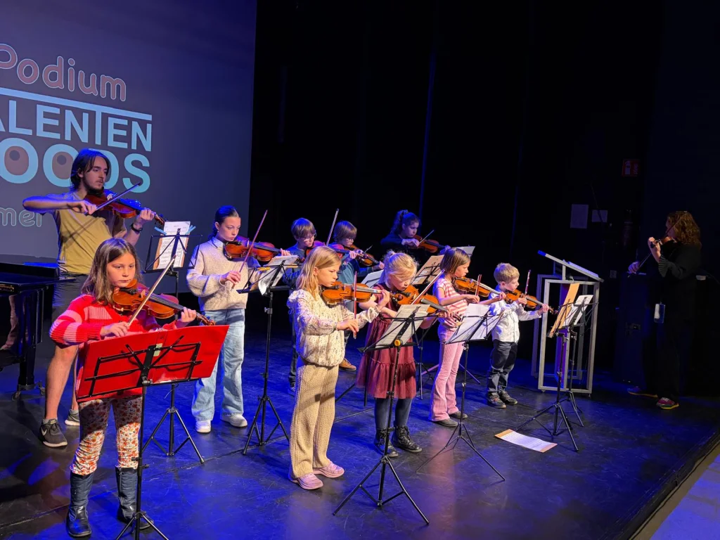 Students playing together on stage